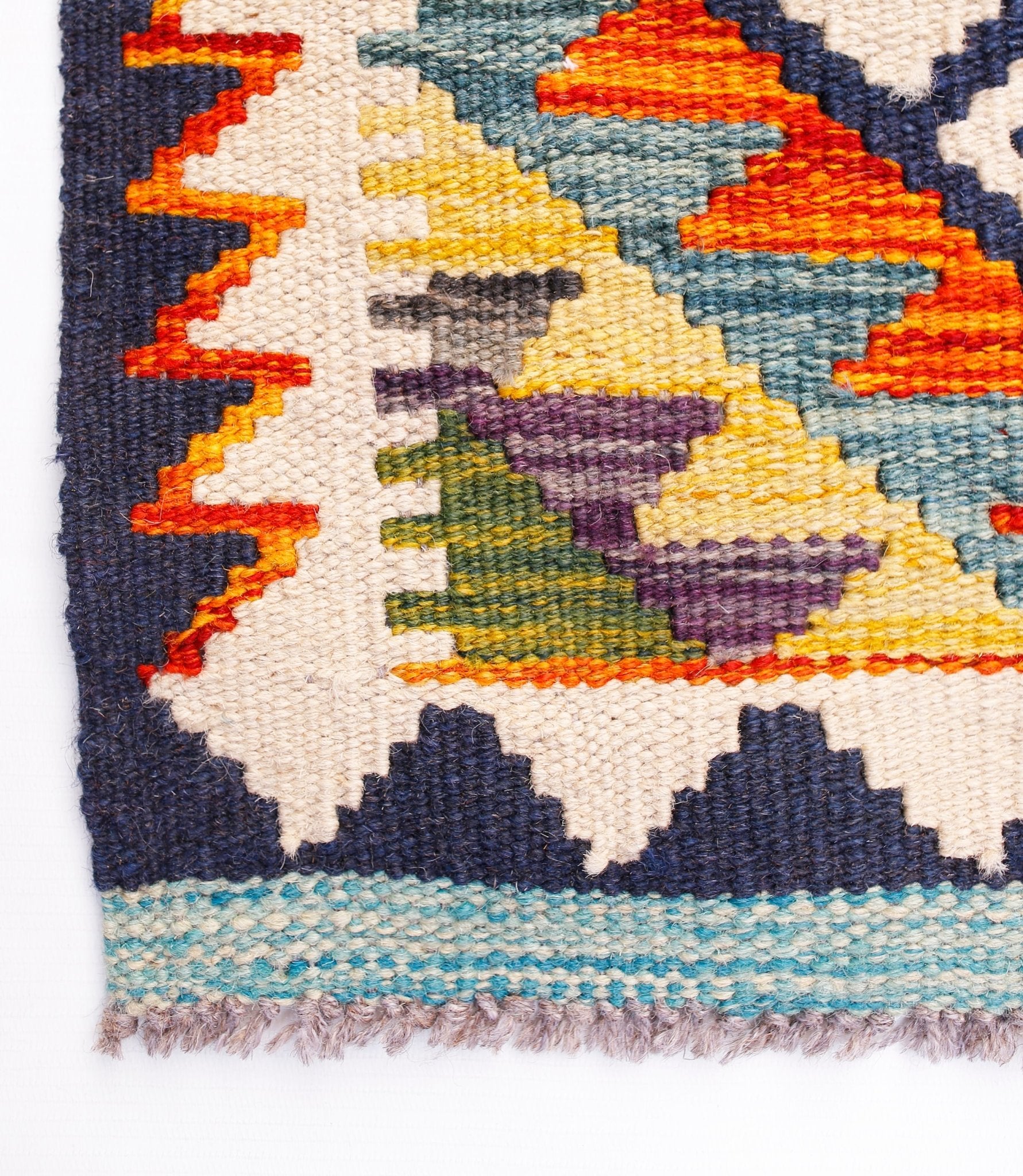 Handwoven Afghan Maimana wool kilim runner featuring a geometric pattern in vibrant colors.