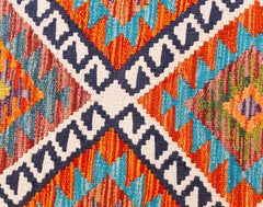 Handwoven Afghan Maimana wool kilim runner featuring a vibrant geometric pattern.