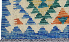A handmade Afghan Maimana kilim runner featuring geometric patterns in blue, green, and orange.