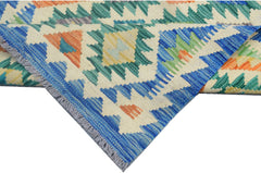 A handmade Afghan Maimana kilim runner featuring a geometric pattern in blue, green, and orange.