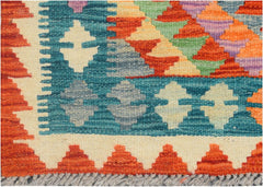 Handmade Afghan Maimana kilim runner featuring a geometric pattern in vibrant multicolored wool.
