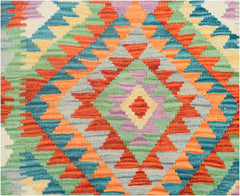 Handmade Afghan Maimana kilim runner featuring a vibrant geometric diamond pattern in wool.
