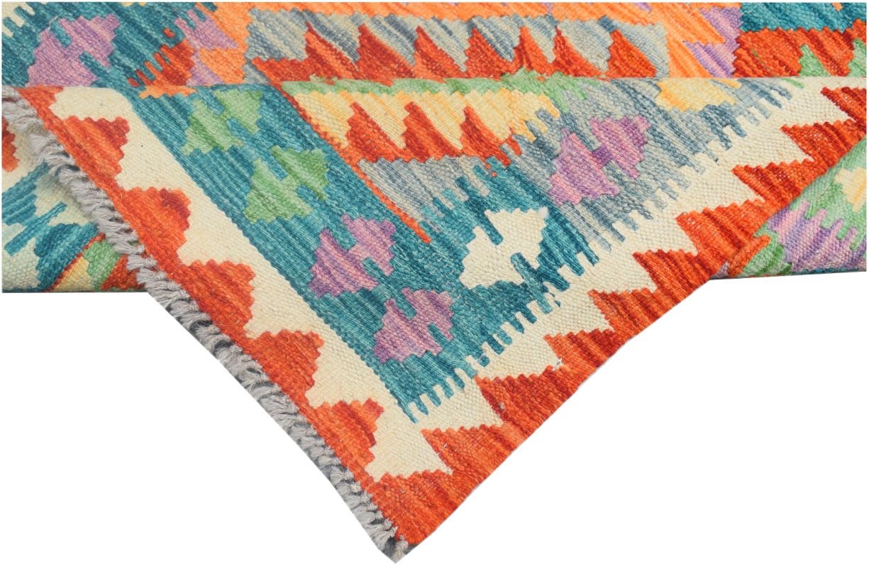 A handmade Afghan Maimana kilim runner featuring vibrant geometric patterns in wool.