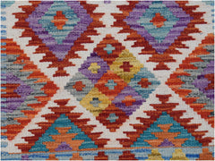 Handwoven Afghan Maimana wool runner featuring a colorful geometric diamond pattern.