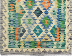 Handmade Afghan Maimana wool runner rug featuring a colorful geometric diamond pattern.