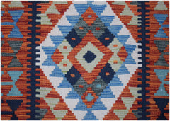 Handwoven Afghan Maimana wool runner featuring a geometric diamond pattern in vibrant colors.