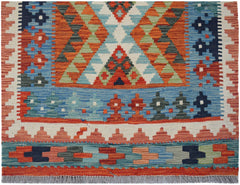 Handwoven Afghan Maimana wool runner featuring a vibrant geometric pattern in a flatweave style.