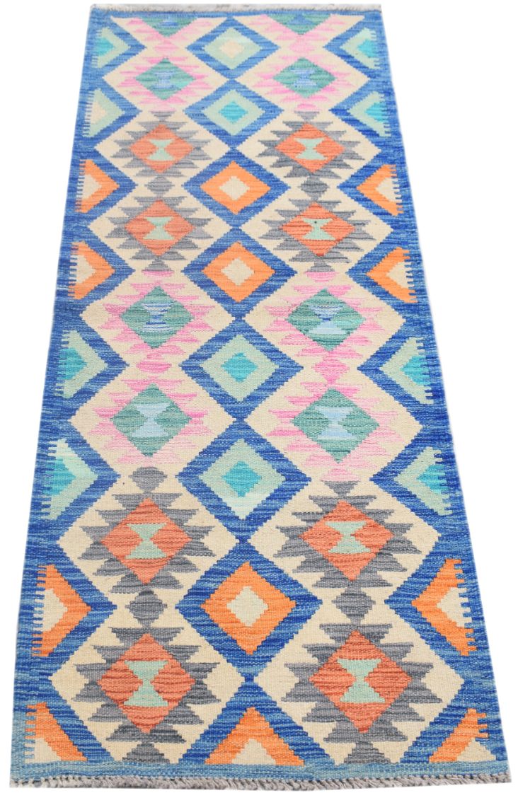Handmade Afghan Maimana wool runner rug featuring a colorful geometric diamond pattern.