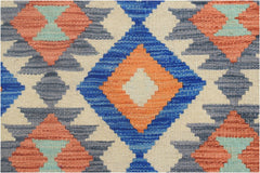 A handmade Afghan Maimana kilim runner featuring a geometric diamond pattern in blue, orange, and tan.