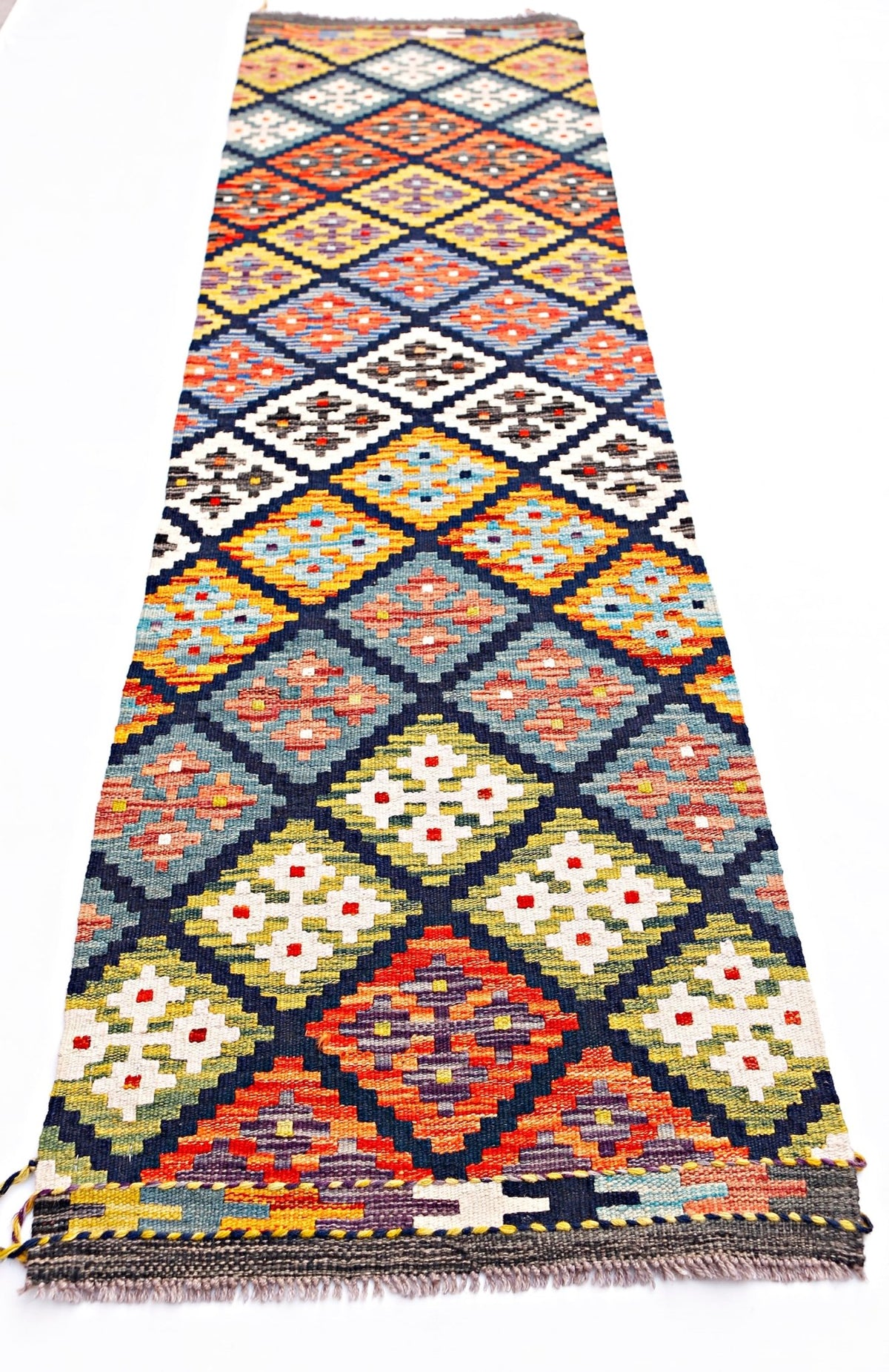 Handwoven Afghan Maimana wool runner featuring a colorful geometric diamond pattern.