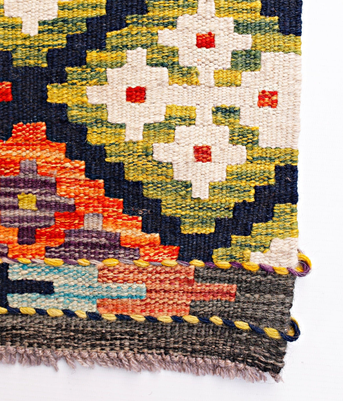 Handwoven Afghan Maimana kilim runner featuring geometric floral patterns in vibrant wool colors.