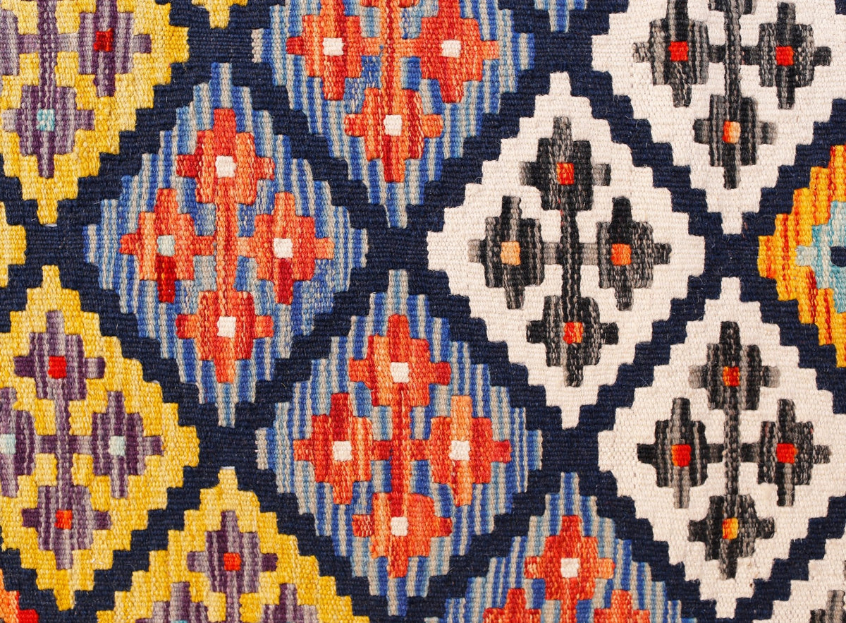 Handwoven Afghan Maimana kilim runner featuring a geometric diamond pattern in vibrant colors.