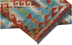 Handwoven Afghan Maimana wool kilim runner featuring a vibrant geometric pattern.