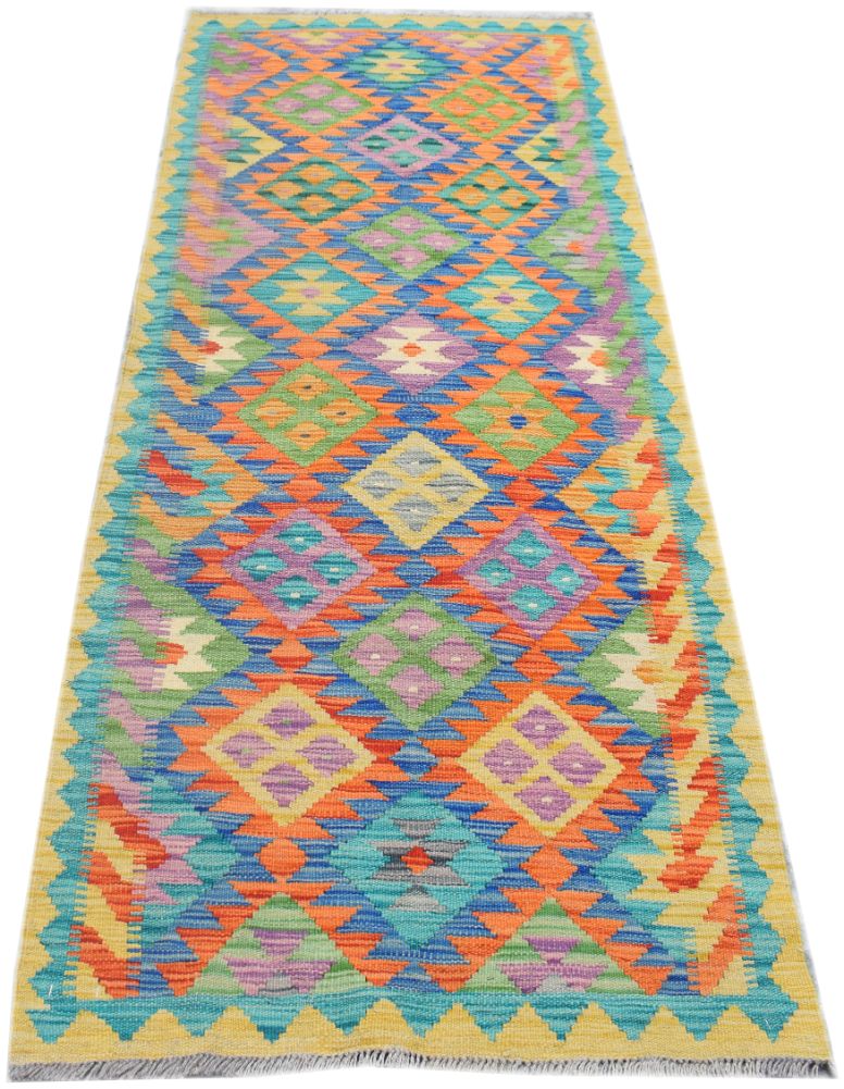Handmade Afghan Maimana wool runner rug featuring a colorful geometric diamond pattern.