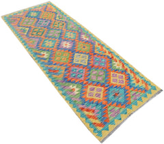 Handmade Afghan Maimana wool runner rug featuring a colorful geometric diamond pattern.