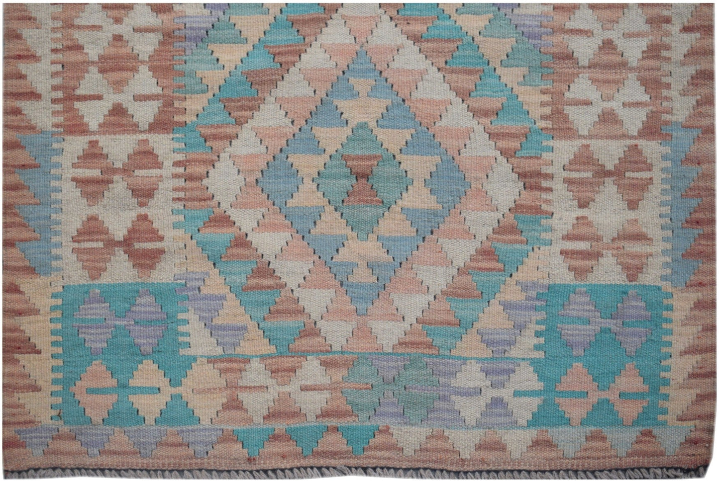 Handmade Afghan Maimana kilim runner featuring a geometric diamond pattern in muted earth tones.