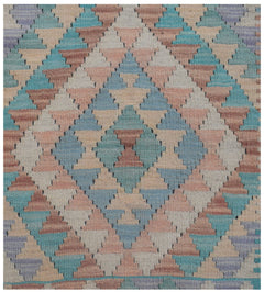 Handmade Afghan Maimana kilim runner featuring a geometric diamond pattern in soft pastel tones.