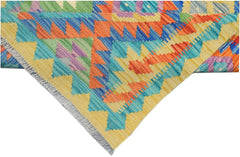 A handmade Afghan Maimana kilim runner featuring vibrant geometric patterns in wool.