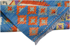 Handwoven Afghan Maimana Kilim runner featuring a blue background with geometric orange patterns.