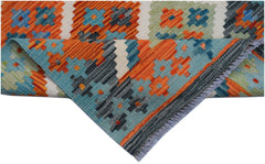 Handwoven Afghan Maimana wool runner featuring a geometric pattern in orange, blue, and green.