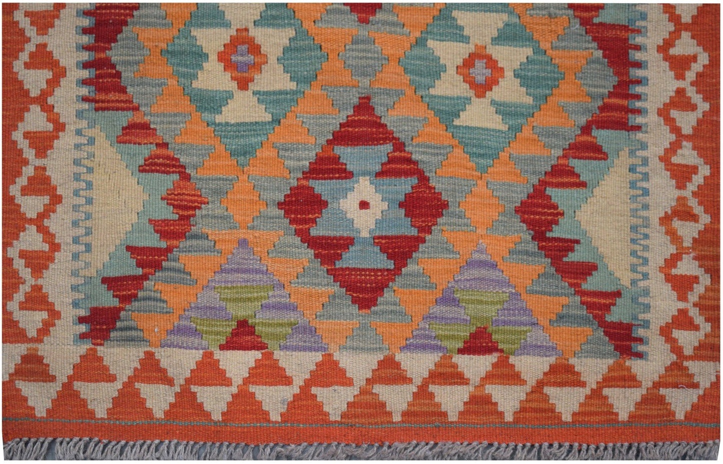 Handmade Afghan Maimana kilim runner featuring a geometric pattern in vibrant orange and blue tones.