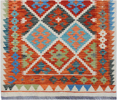 Handwoven Afghan Maimana wool runner featuring a vibrant geometric diamond pattern.