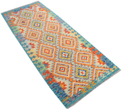 Handmade Afghan Maimana Kilim runner featuring a vibrant geometric diamond pattern in wool.
