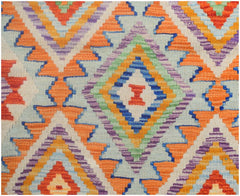 Handmade Afghan Maimana kilim runner featuring a vibrant geometric diamond pattern in wool.