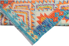 A handmade Afghan Maimana kilim runner featuring vibrant geometric patterns in wool.