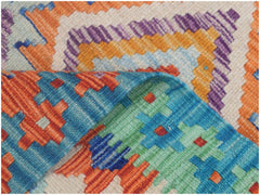 A handmade Afghan Maimana kilim runner featuring vibrant geometric patterns in wool.
