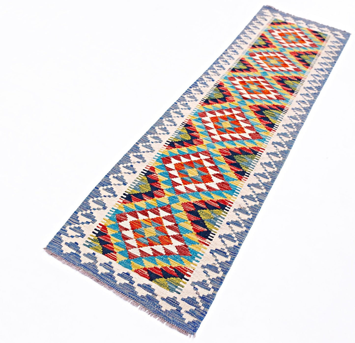 A handmade Afghan Maimana wool runner featuring a colorful geometric diamond pattern.