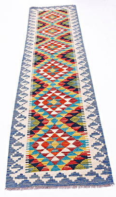 Handwoven Afghan Maimana wool runner featuring a colorful geometric diamond pattern.