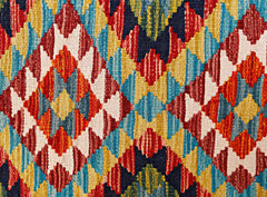 Handwoven Afghan Maimana wool kilim runner featuring a vibrant geometric diamond pattern.