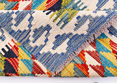A handwoven Afghan Maimana wool kilim runner featuring a colorful geometric pattern.