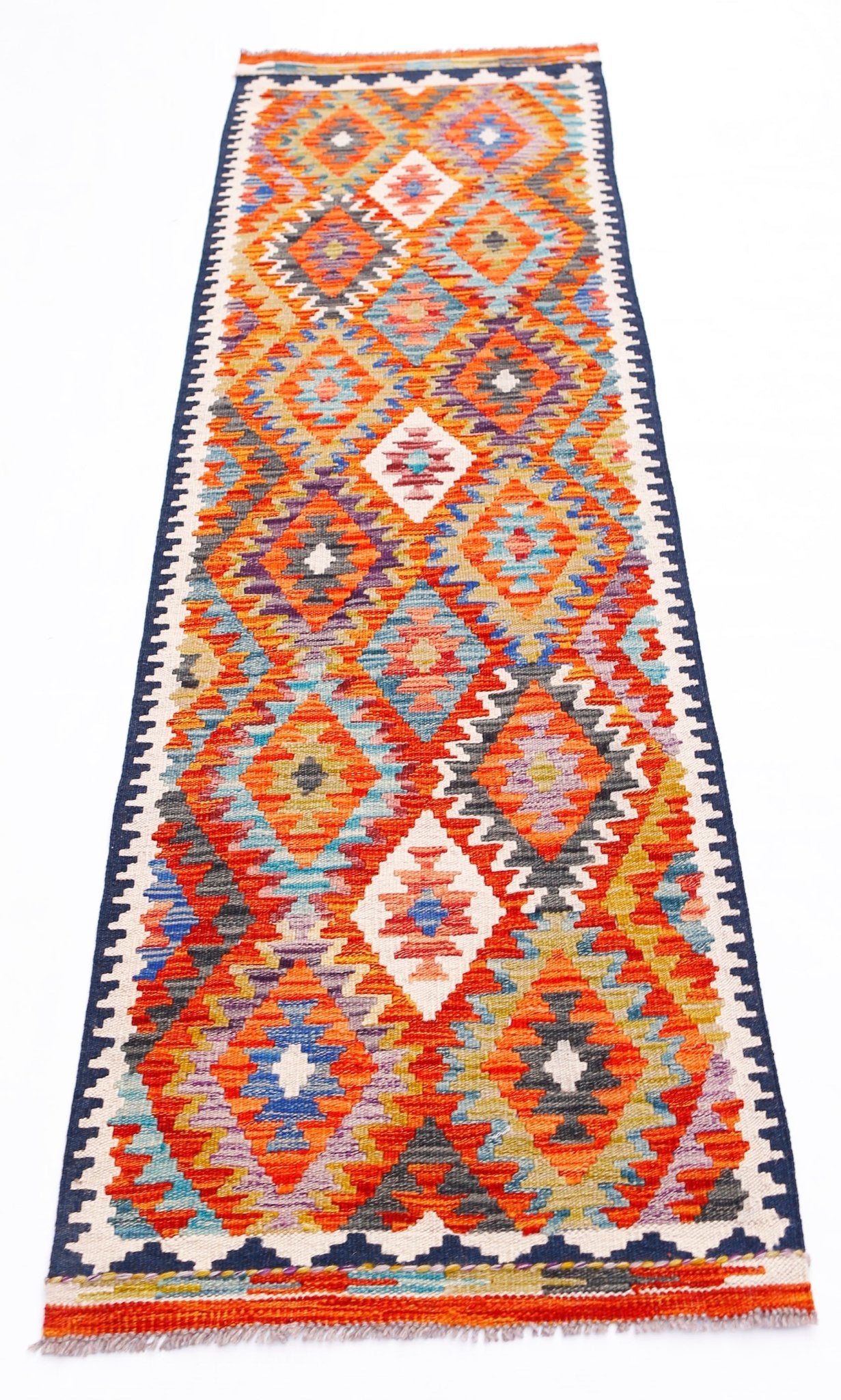 Handwoven Afghan Maimana wool runner rug featuring a vibrant geometric diamond pattern.