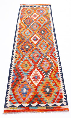 Handwoven Afghan Maimana wool runner rug featuring a vibrant geometric diamond pattern.