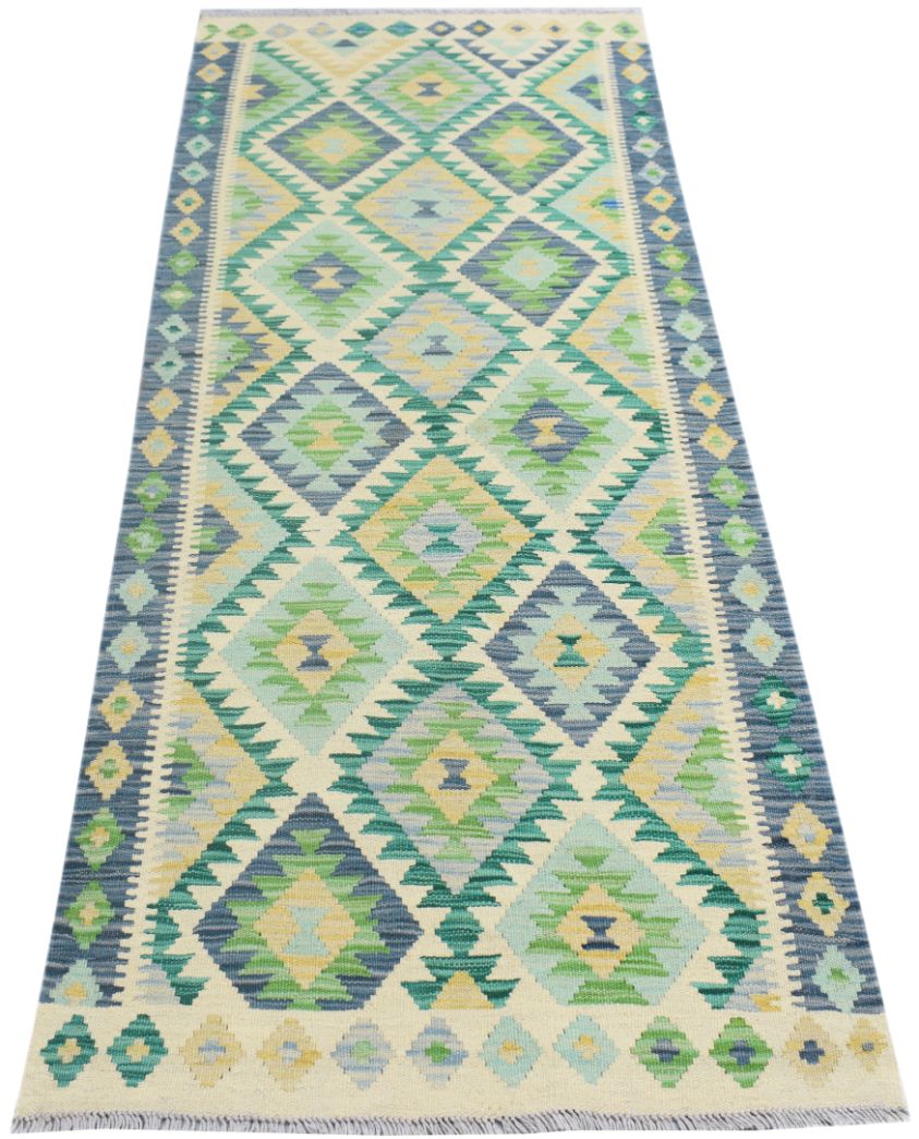 Handmade Afghan Maimana wool runner rug featuring a geometric diamond pattern in blue and green.