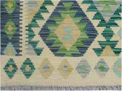 Handmade Afghan Maimana kilim runner featuring a geometric pattern in blue, green, and yellow.