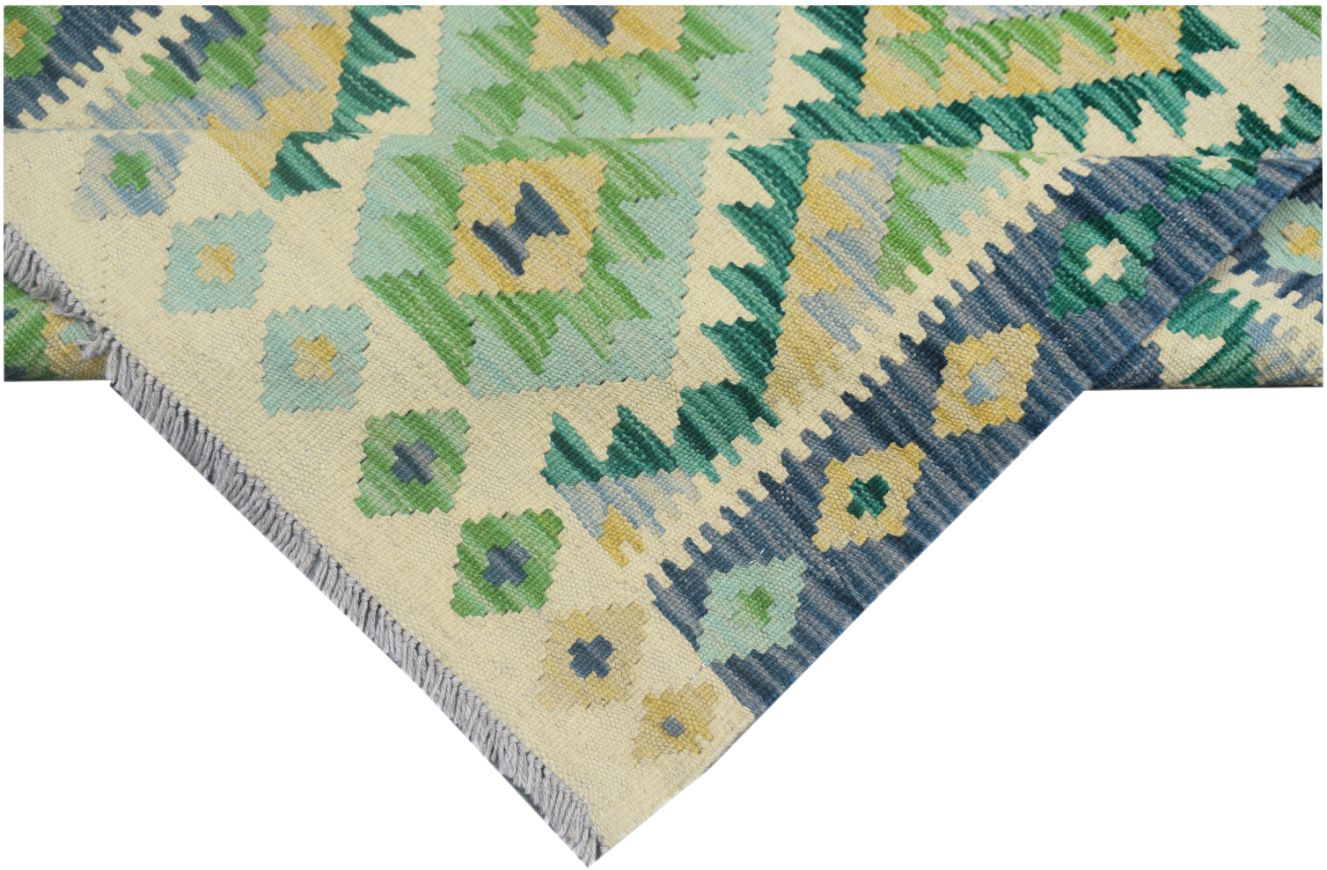 Handmade Afghan Maimana kilim runner featuring geometric patterns in shades of green, blue, and tan.