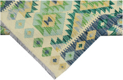 Handmade Afghan Maimana kilim runner featuring geometric patterns in shades of green, blue, and tan.