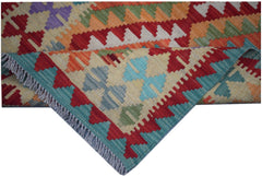 A handmade Afghan Maimana kilim runner featuring vibrant geometric patterns in wool.