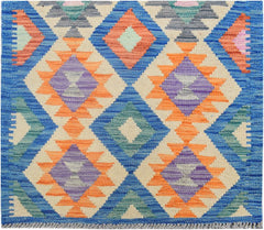 Handmade Afghan Maimana kilim runner featuring a colorful geometric diamond pattern.