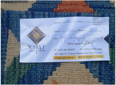 An Afghan Maimana kilim runner featuring a geometric pattern in rich blue, orange, and tan tones.