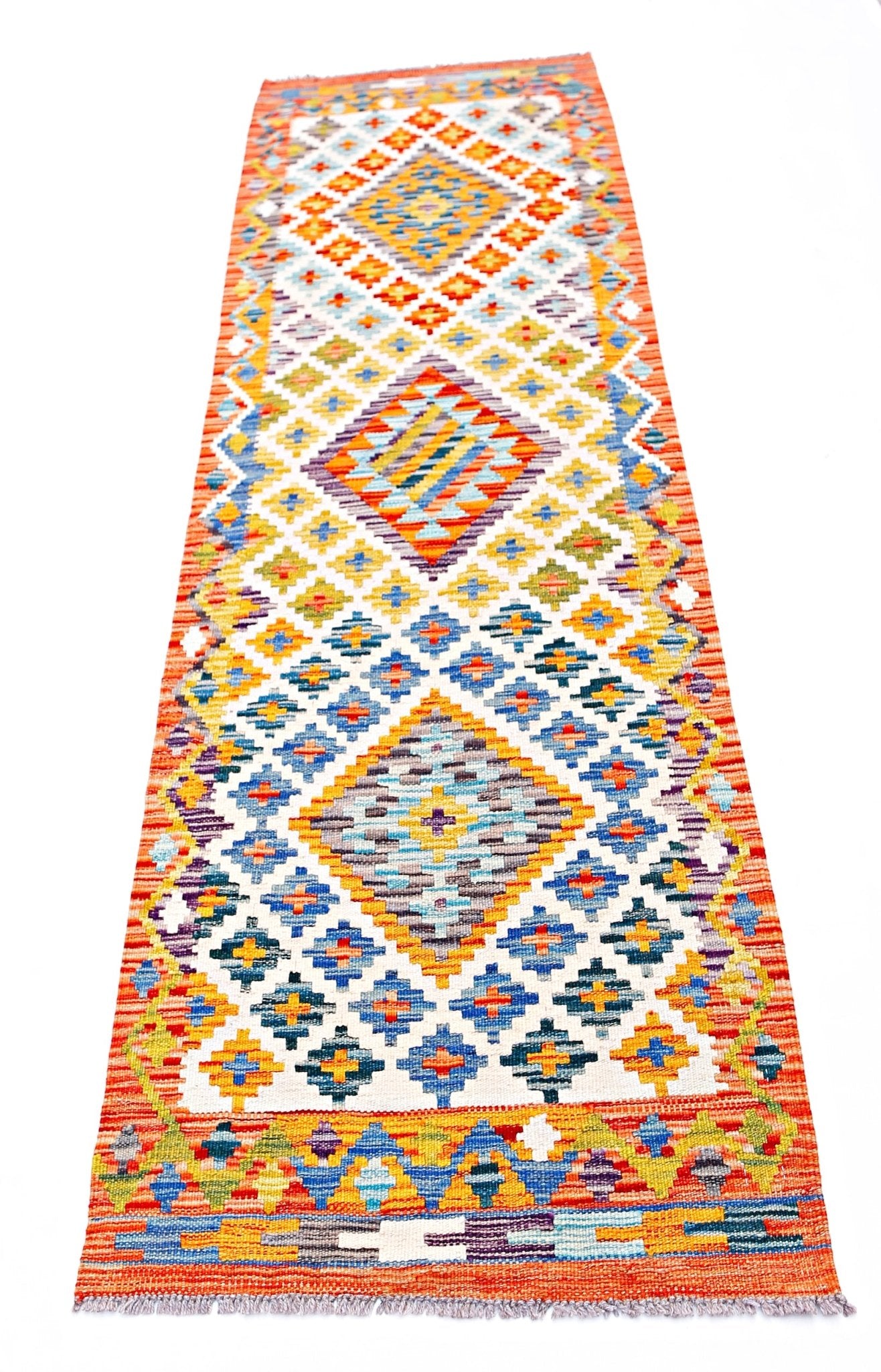 Handwoven Afghan Maimana wool runner rug featuring a colorful geometric diamond pattern.