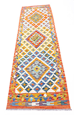 Handwoven Afghan Maimana wool runner rug featuring a colorful geometric diamond pattern.