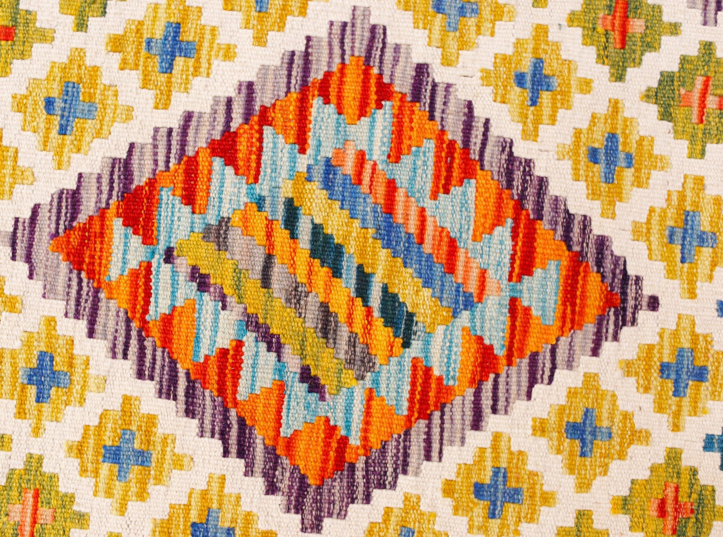 Handwoven Afghan Maimana kilim runner featuring a geometric diamond pattern in vibrant colors.