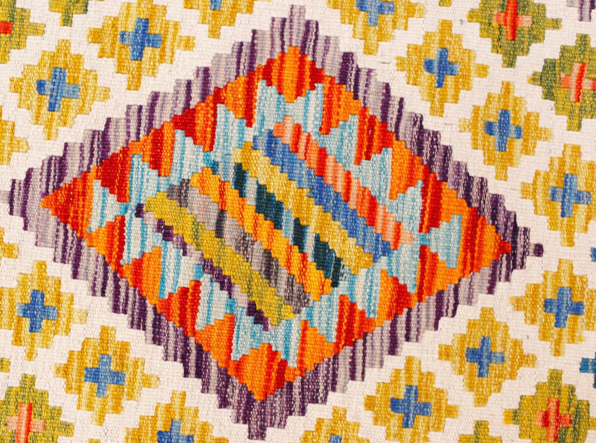 Handwoven Afghan Maimana kilim runner featuring a geometric diamond pattern in vibrant colors.