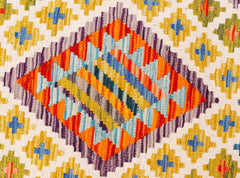 Handwoven Afghan Maimana kilim runner featuring a geometric diamond pattern in vibrant colors.