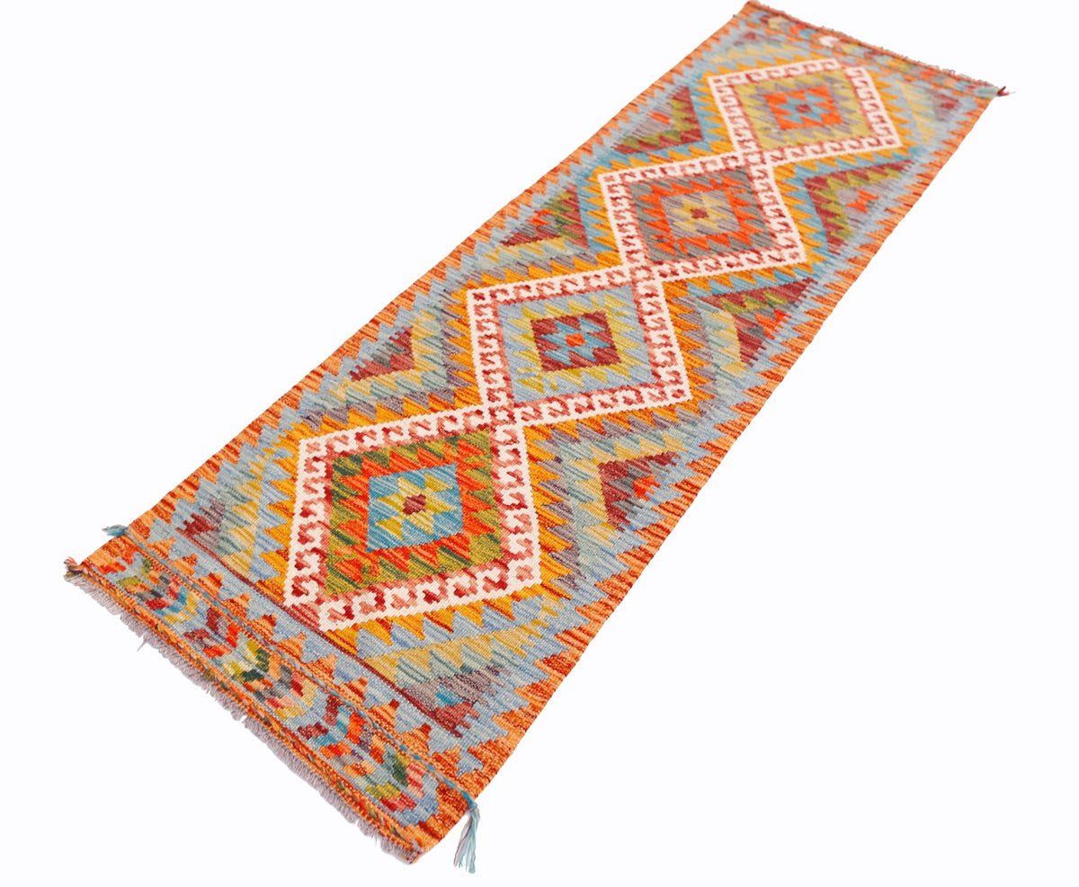 Handwoven Afghan Maimana wool runner rug featuring a colorful geometric diamond pattern.