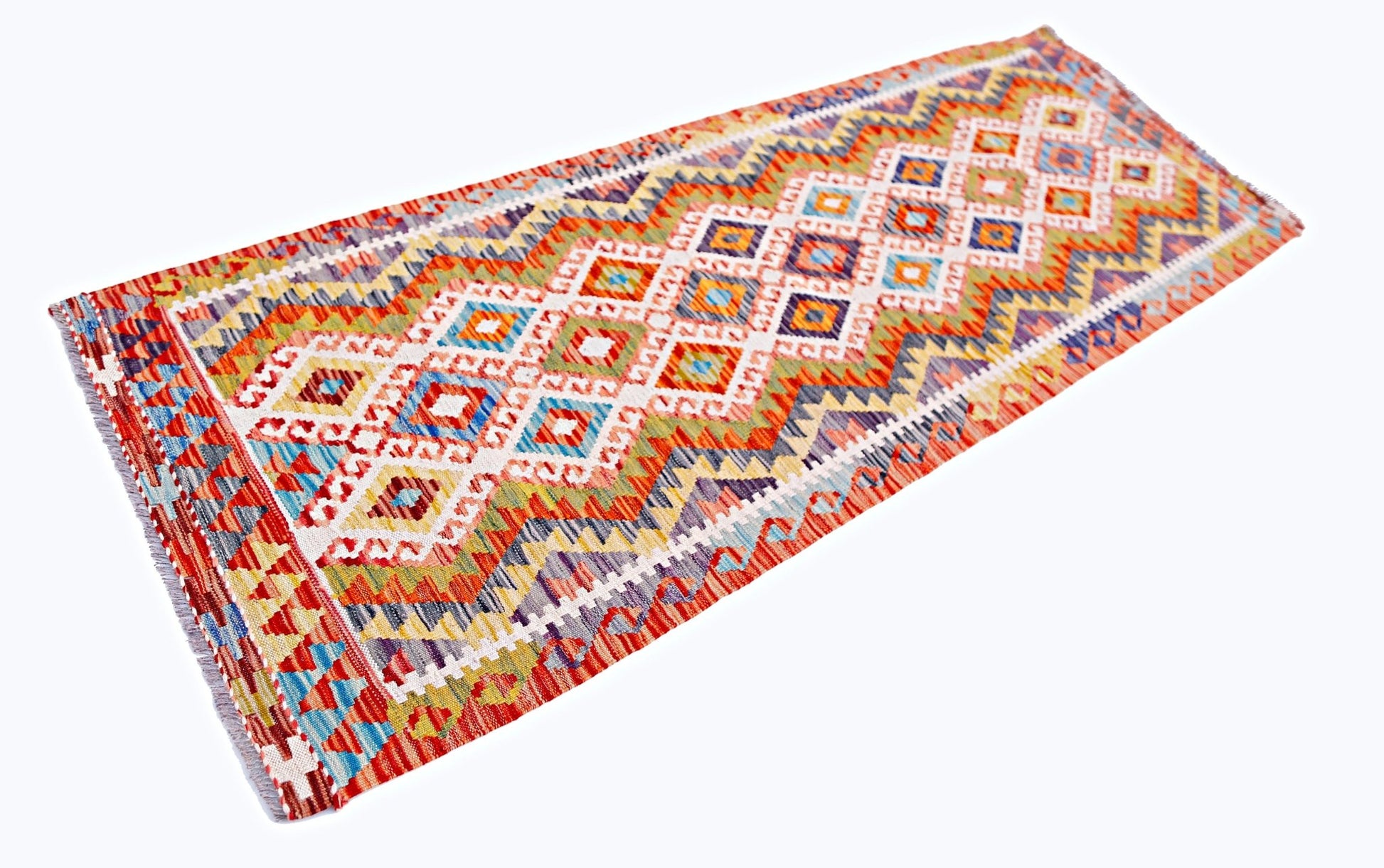 A handmade Afghan Maimana wool runner rug featuring a vibrant, geometric diamond pattern.